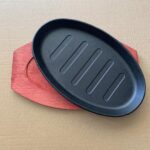 The Hot Sizzling Plate With Bamboo Holder