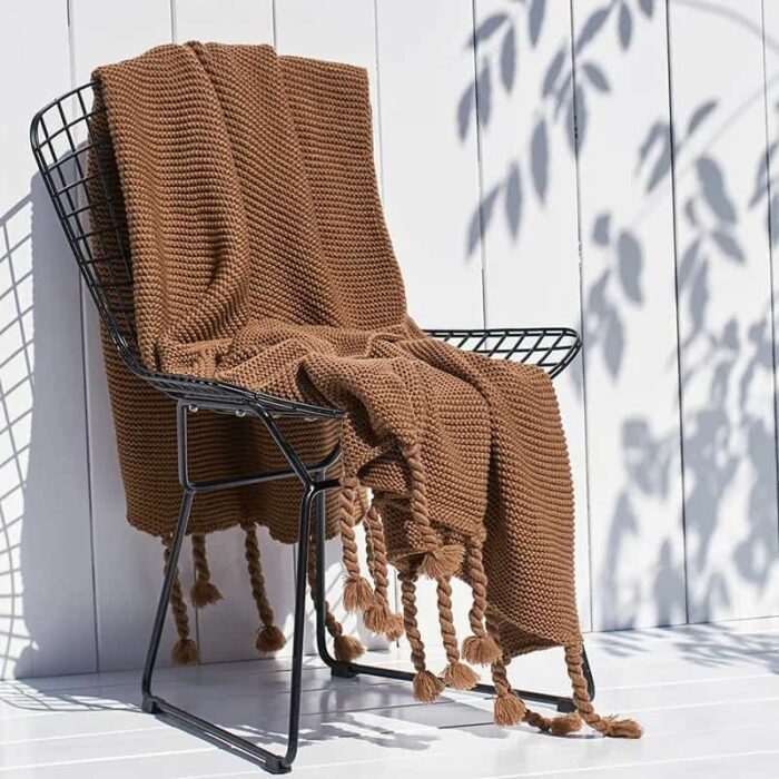 Soft knitted throw blankets with tassels