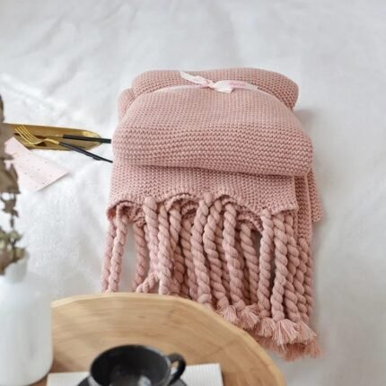 Soft knitted throw blankets with tassels